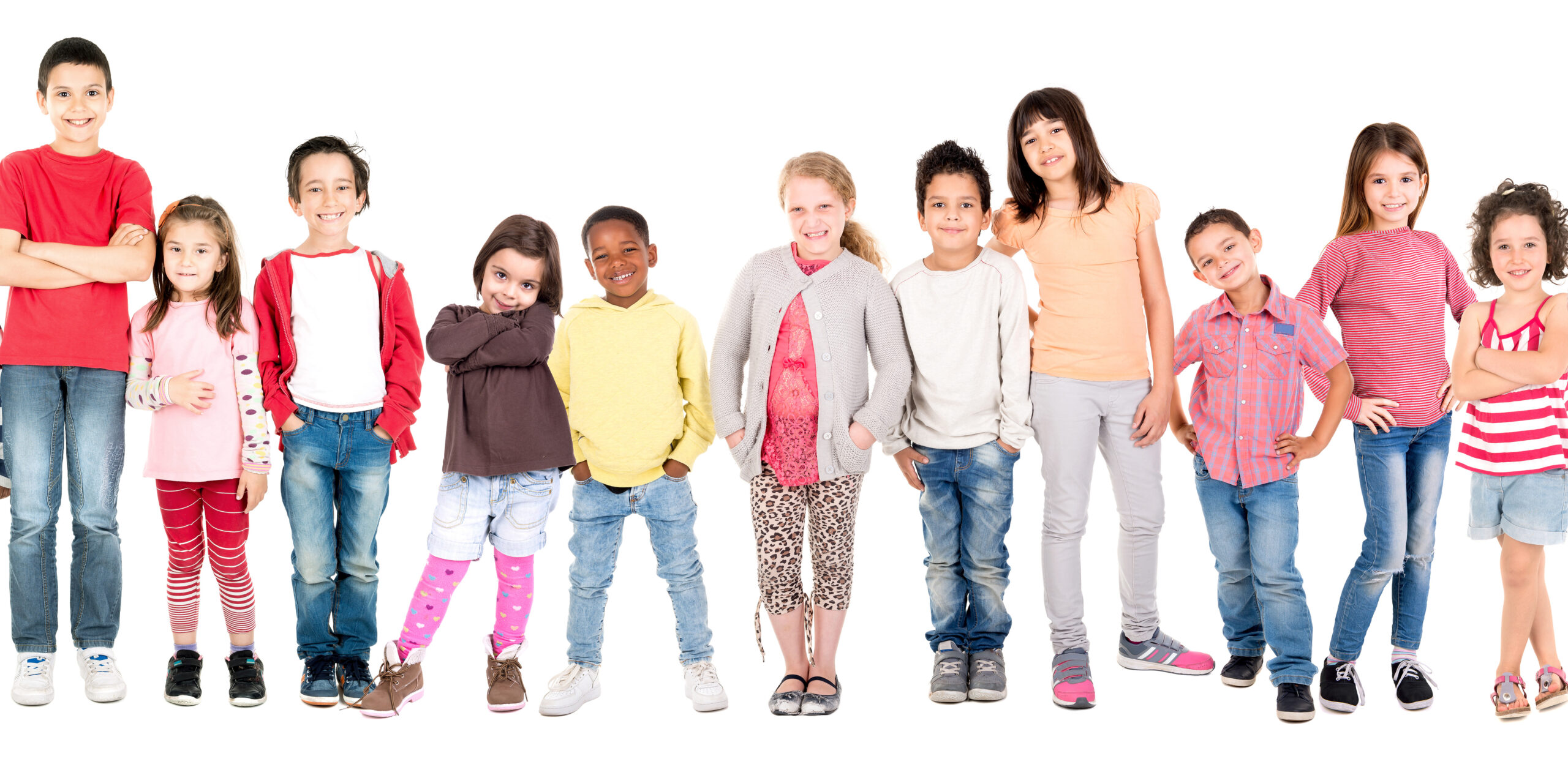 Large group of children posing isolated in white